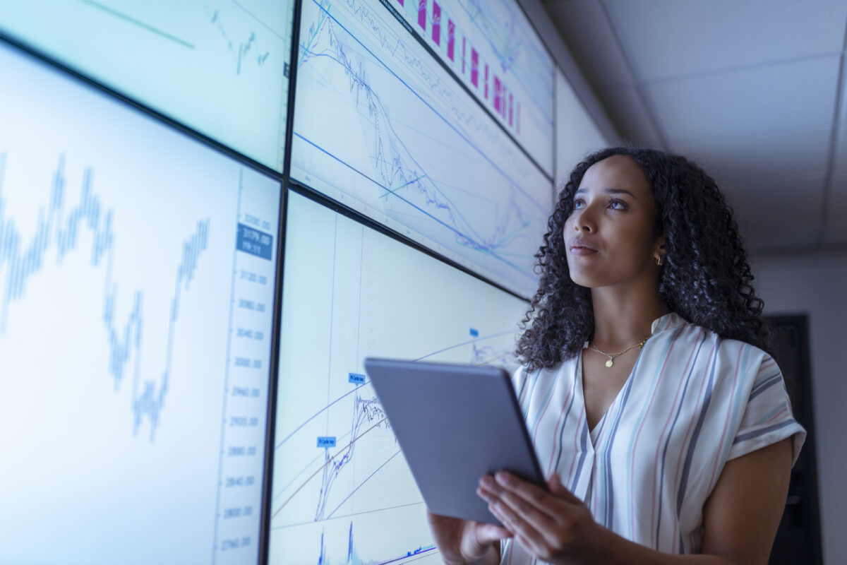 businesswoman-with-tablet-looking-at-data