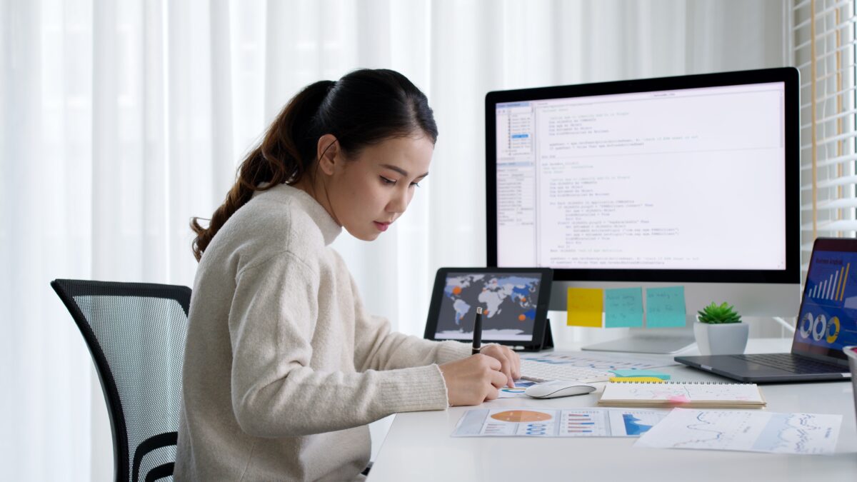 woman coding at computer on Northcoders bootcamp